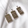 Image shows the back of zodiac necklaces in silver in Taurus, Capricorn and Virgo variants